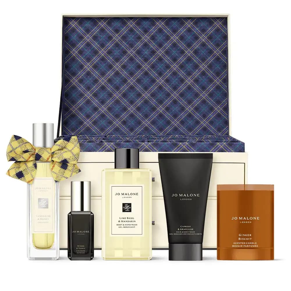 Open cream advent chest lined in navy tartan with Tangerine & Honey, body wash, hair wash and Ginger Biscuit candle