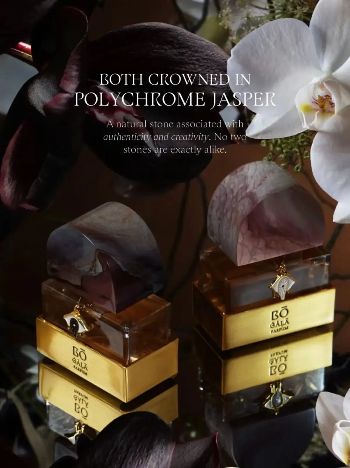 Both Gala bottles on a mirrored surface among dark and white orchids, captioned as crowned in polychrome jasper