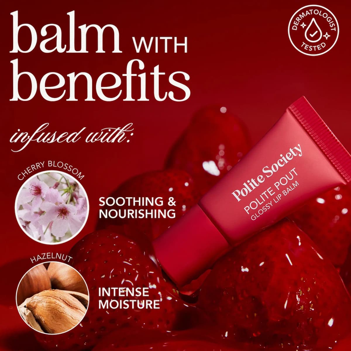 Red lip balm tube on strawberries with text noting cherry blossom and hazelnut benefits and a dermatologist-tested badge
