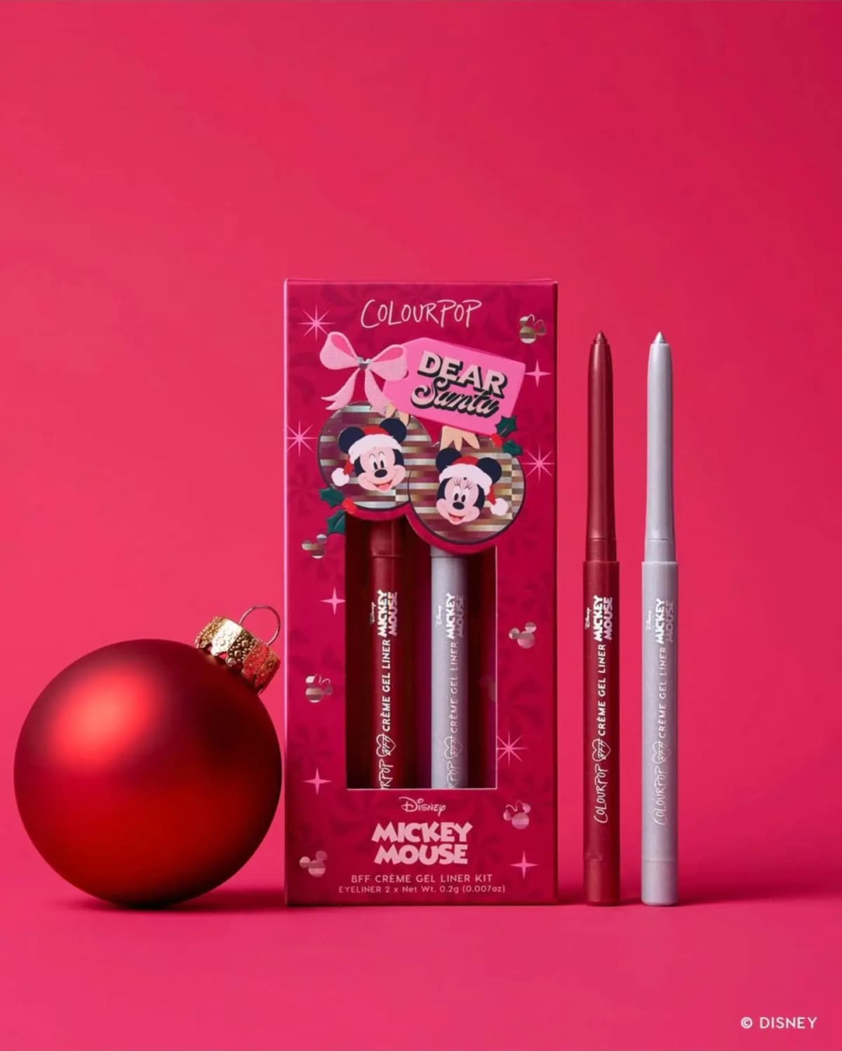 Dear Santa BFF Creme Gel Liner Kit box with a metallic red and a silver eyeliner beside a red ornament