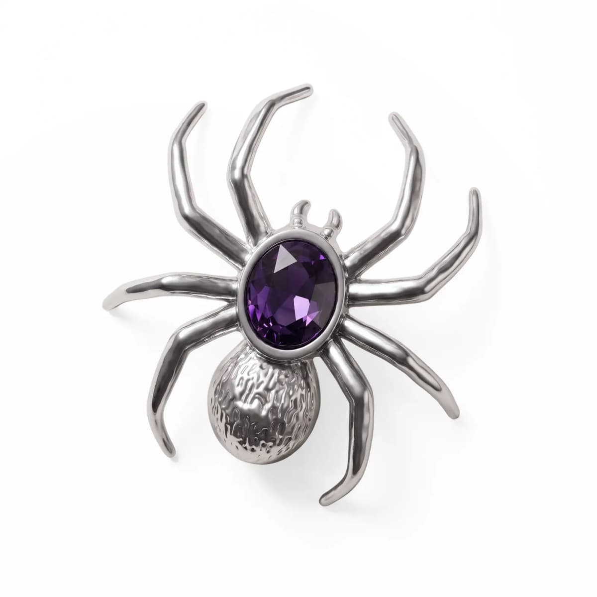 Top view of silver spider pin with eight curved legs, bezel-set purple gem and hammered abdomen