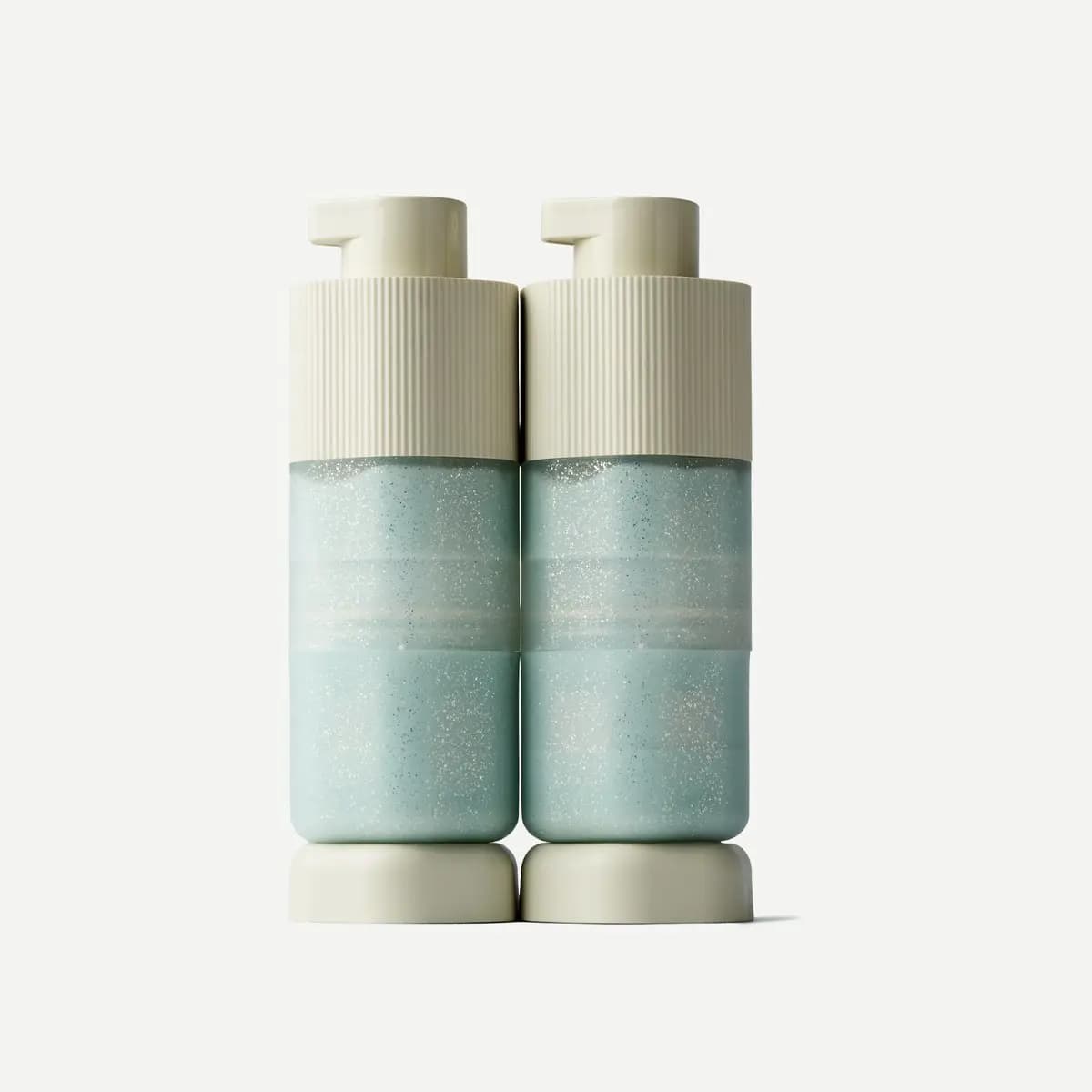 Pair of Large Pump Capsules in sparkly pale aqua with cream ribbed pump tops on cream bases
