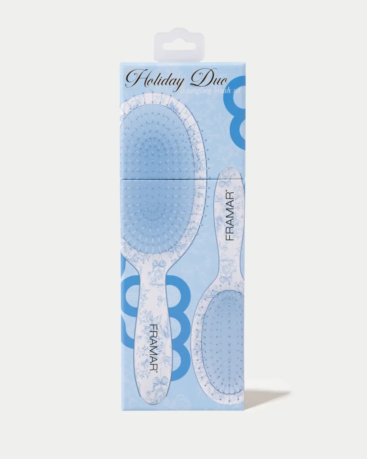 Light-blue FRAMAR Holiday Duo detangling brush set box with hang tab, showing both brushes