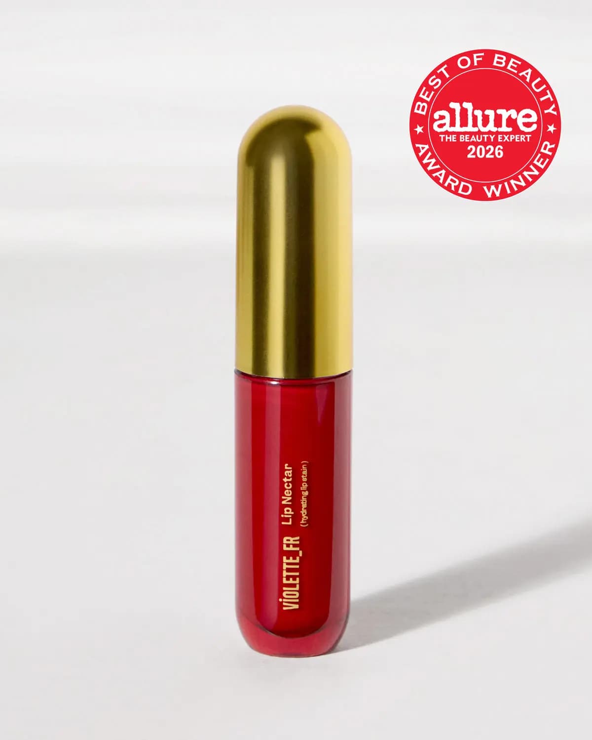 Violette_FR Lip Nectar hydrating lip stain in a red tube with gold dome cap and Allure Best of Beauty 2026 badge.
