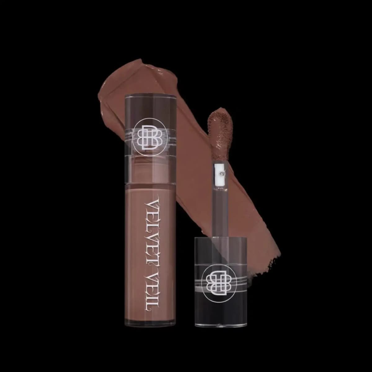 Warm milk-chocolate nude lip mud tube with applicator and a soft matte swatch