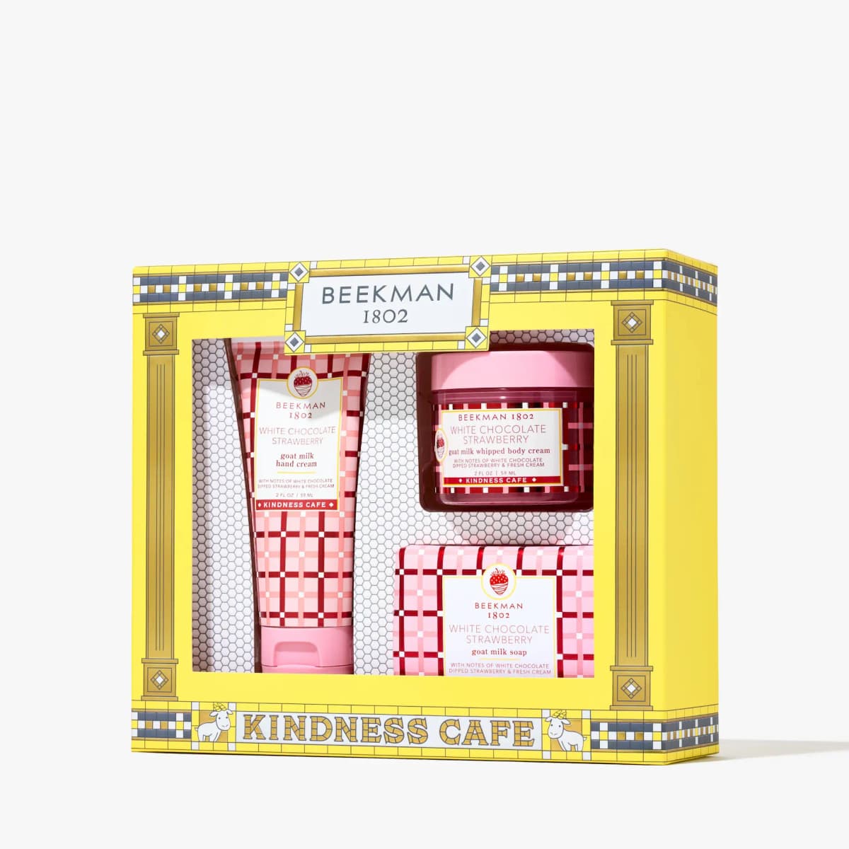 Yellow Beekman 1802 Kindness Café gift set with hand cream tube, whipped body cream jar, and wrapped soap bar