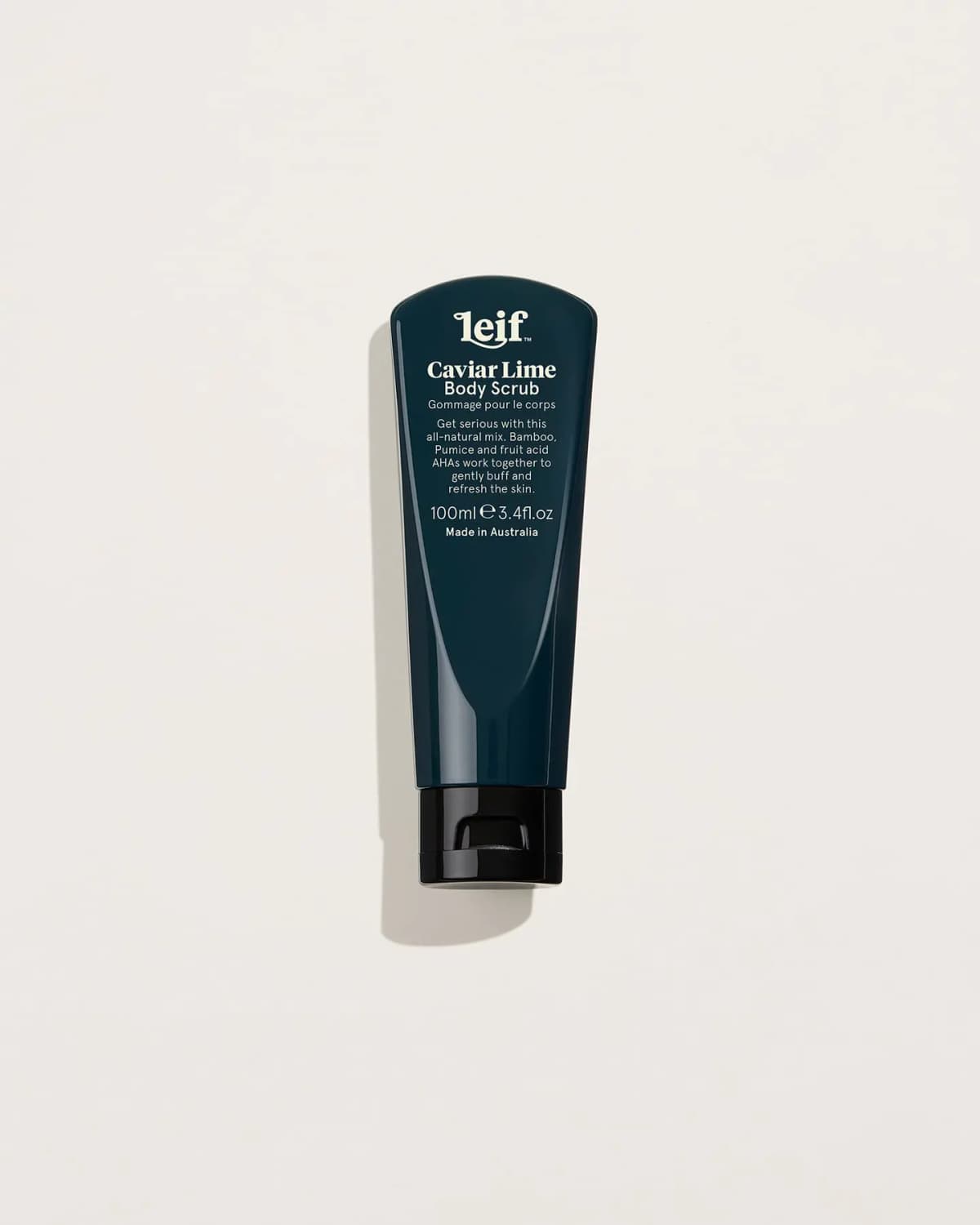 Leif Caviar Lime Body Scrub 100ml dark teal tube with black flip cap on a cream background