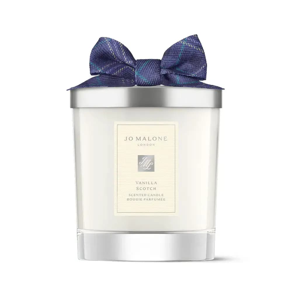 Vanilla Scotch scented candle in white glass with silver lid and purple tartan bow