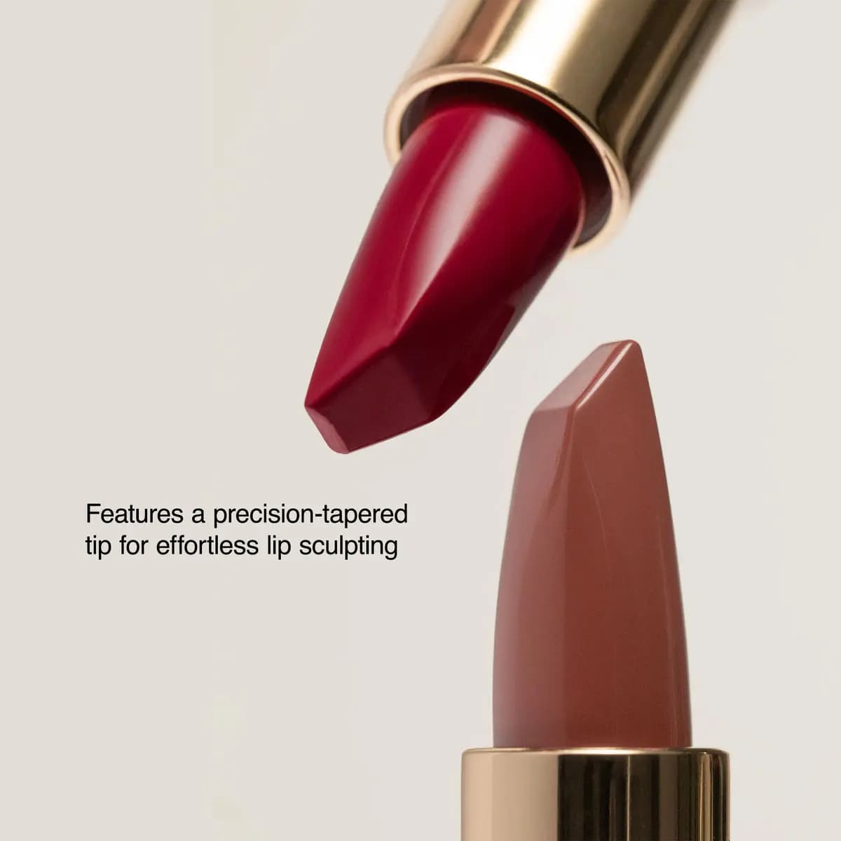 Close-up of a deep red and a rosy nude lipstick bullet showing the precision-tapered tip