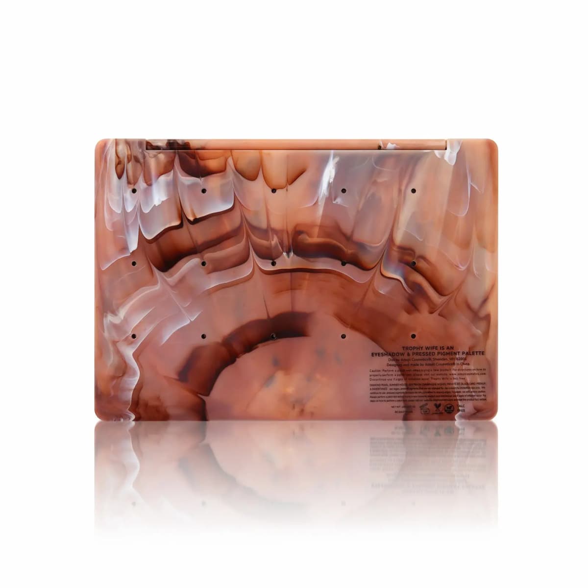 Back of the marbled palette with pan push-out holes and printed label text for Trophy Wife
