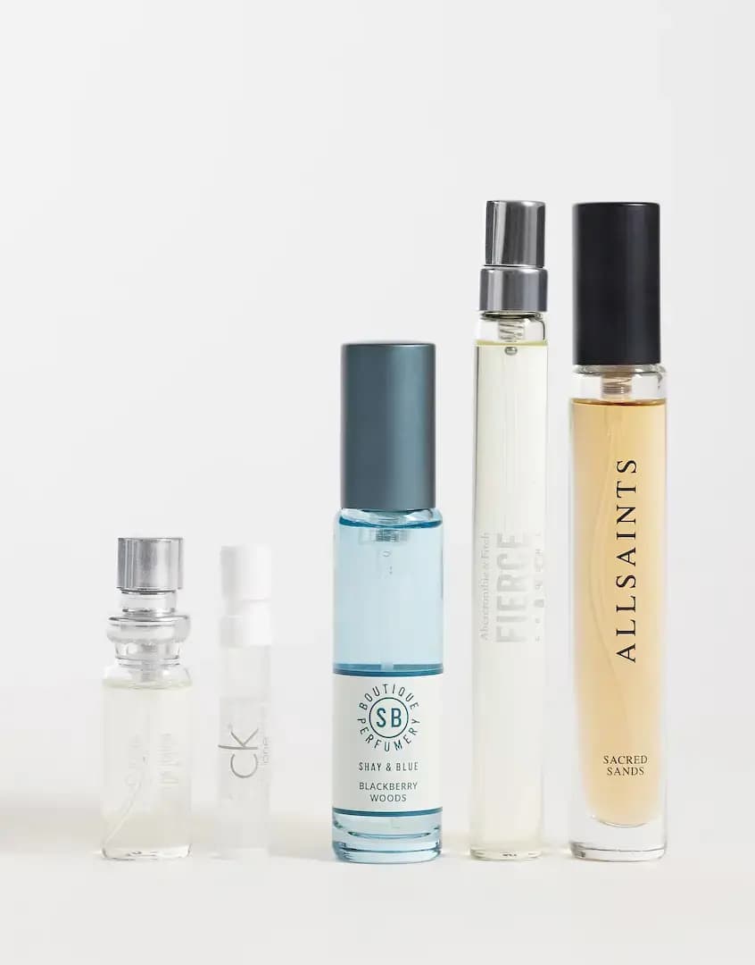 Five men's fragrances in a row, from a small spray and CK One vial to Blackberry Woods, Fierce and AllSaints