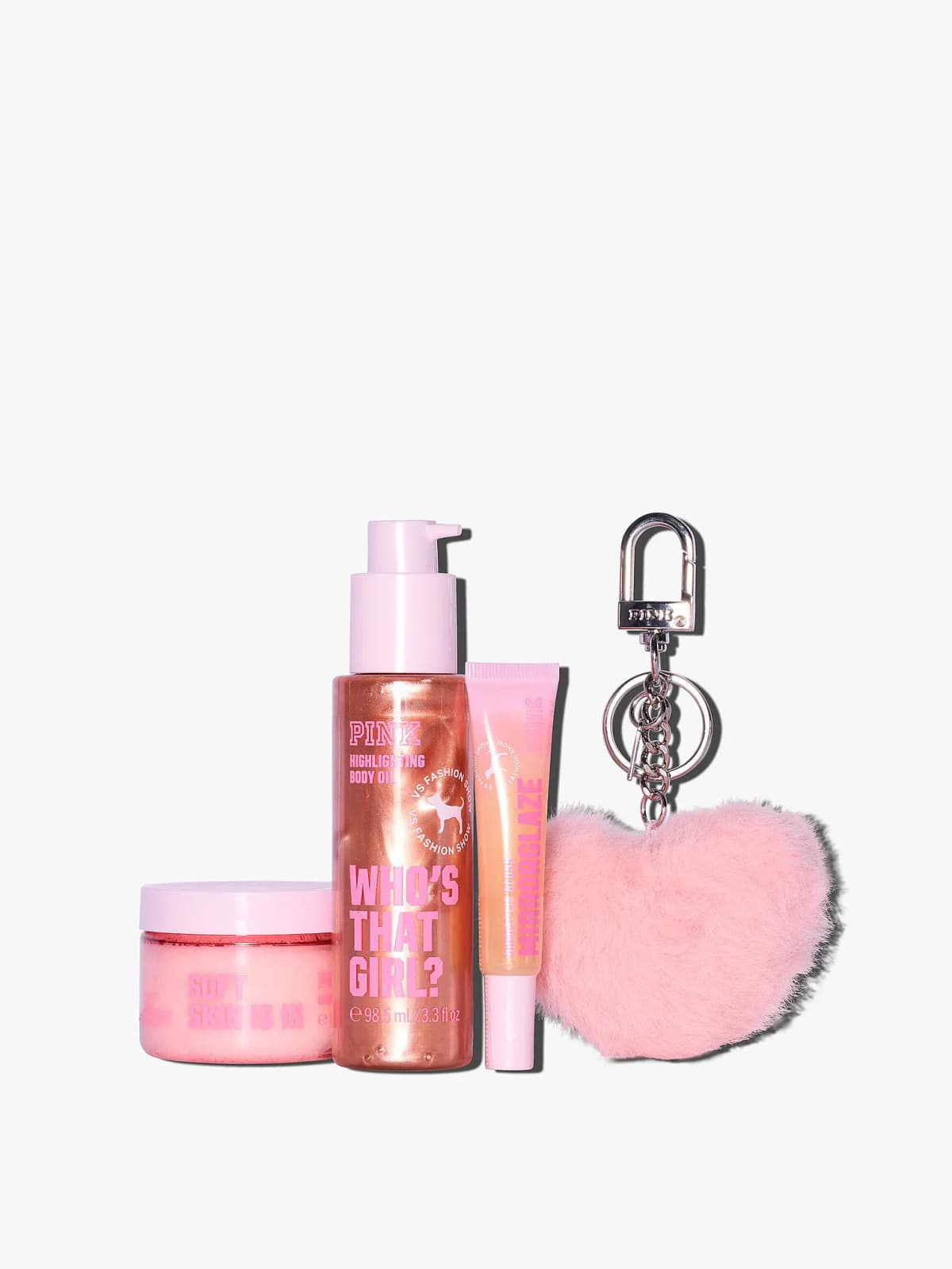 Unboxed PINK Soft Skin Is In scrub, Who's That Girl? highlighting body oil, Mirrorglaze gloss and pink fluffy heart keychain