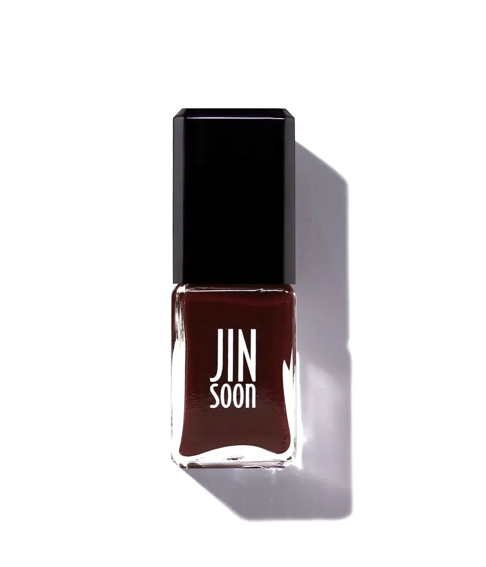 JINsoon nail polish bottle with black cap filled with a blackened red jelly shade on a white background